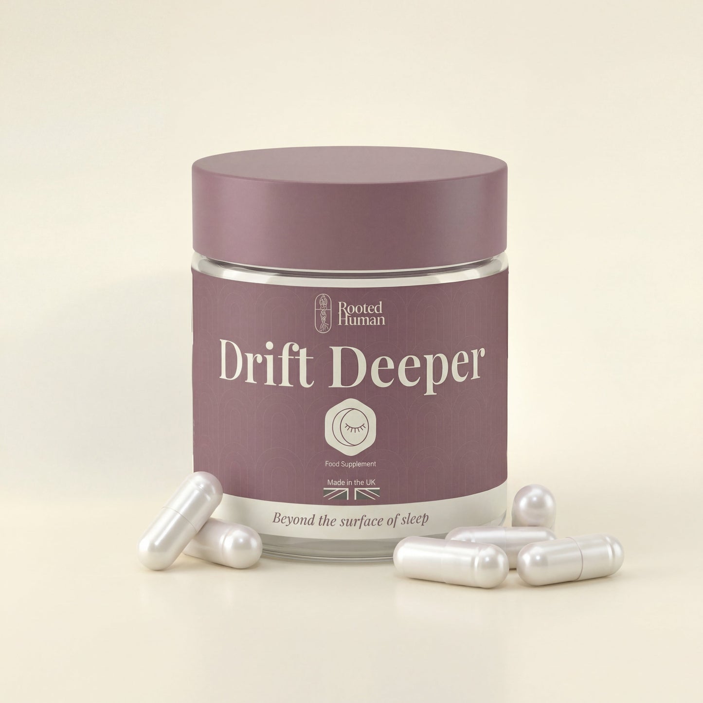 Jar of 'Drift Deeper' supplements with capsules on a beige background